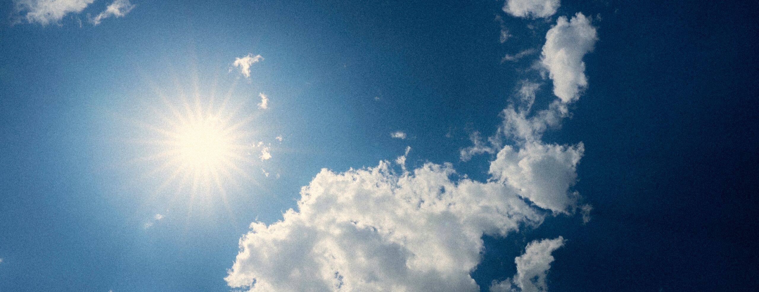 Sun in sky with clouds